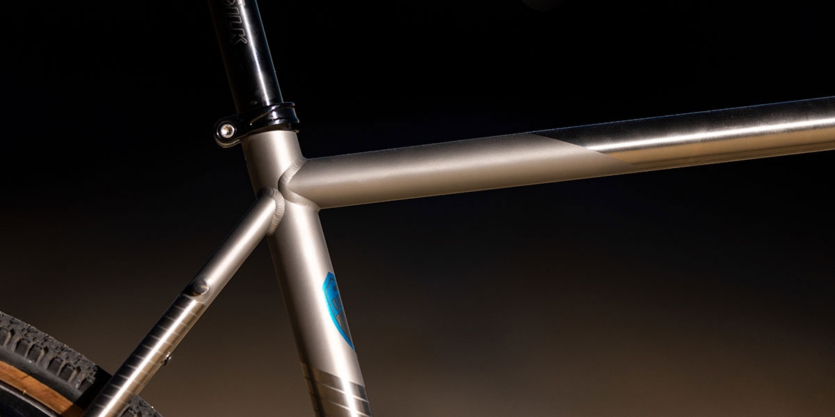 All-City Cosmic Stallion Titanium Frameset detail showing top tube, seat tube, and seat stay junction