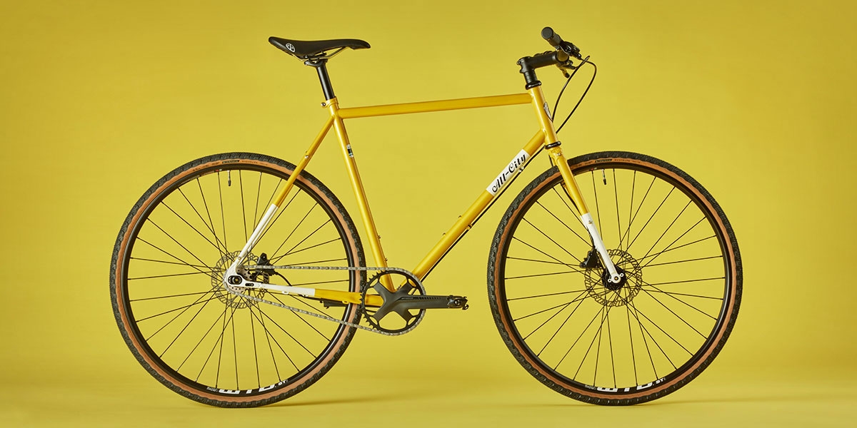 All-City Cycles Super Professional Single Speed bike side view in Yellow Dab color on yellow background