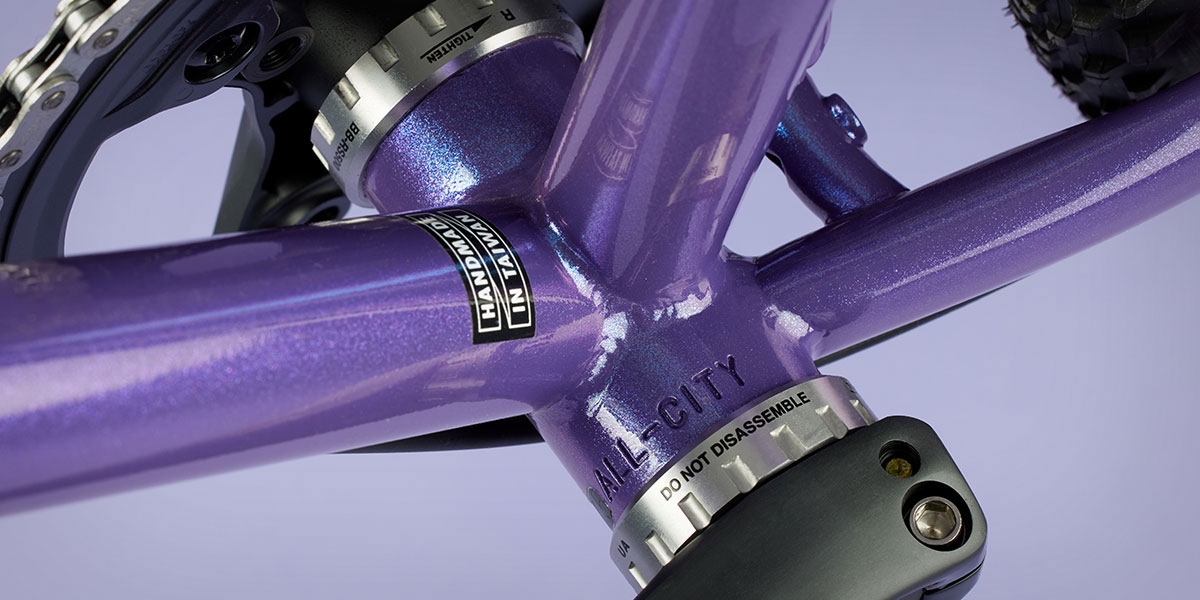 All-City Cycles Super Professional Single Speed Drop Bar bike in Hollywood Violet close-up of bottom bracket area