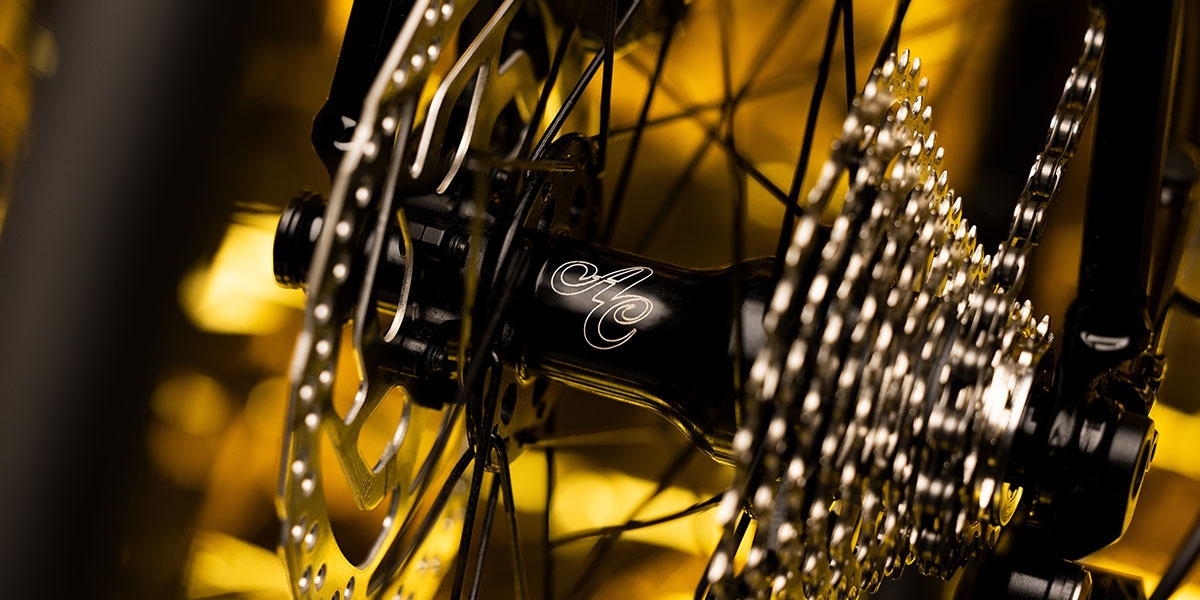 Close-up of black All-City Go Devil rear disc hub and cassette on Zig Zag 105 complete bike
