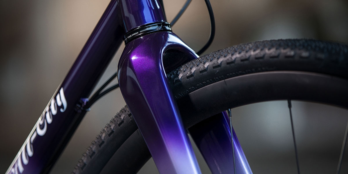 Purple All-City Cycles Cosmic Stallion Force 1 bike front wheel frame view 
