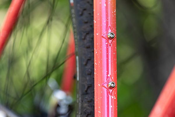 Close-up of reinforced water bottle mounts on seat tube Nature Cross Single Speed Pink Lemonade bike