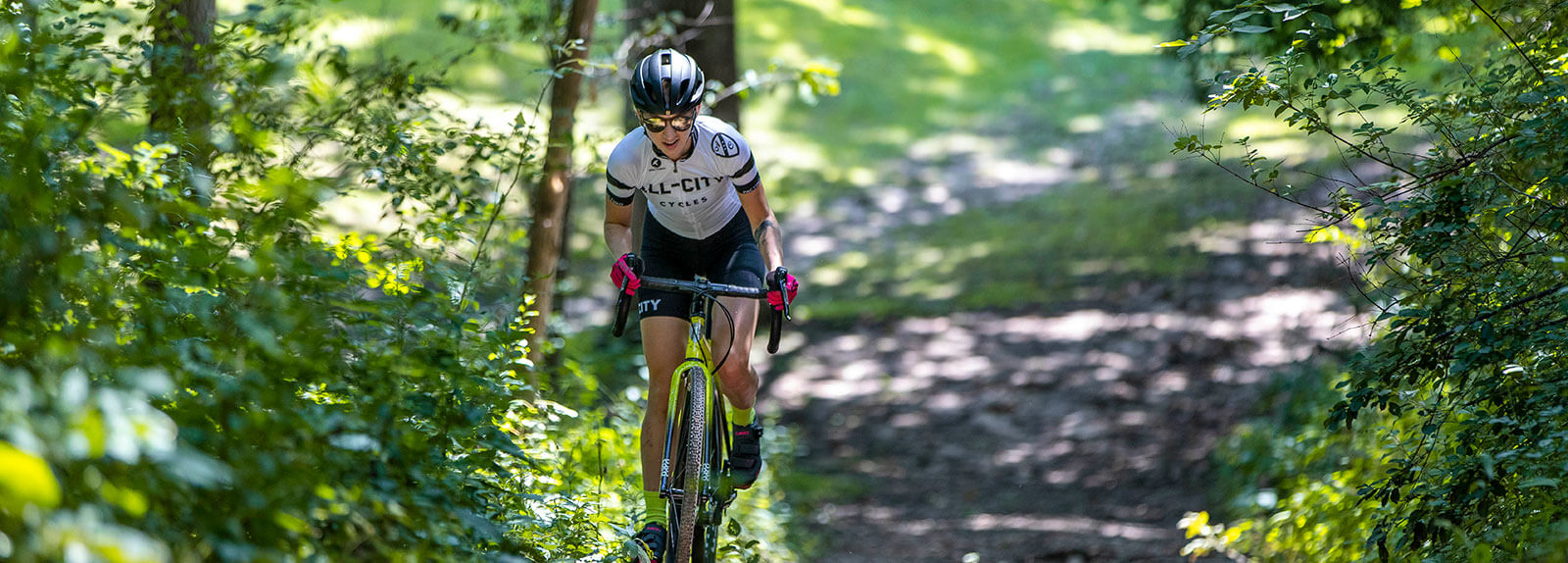 Person riding All-City Nature Cross Geared bike on outdoor trail