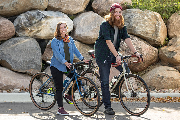 Two people riding All-City SpaceHorse bikes outdoors