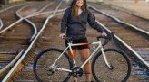 Jenny Carmichael Posing with Bike on Train Tracks