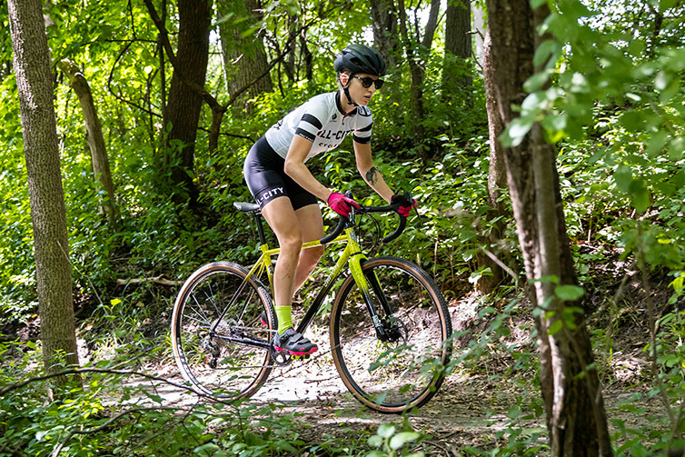 Person rides yellow and black All-City Macho King outdoor trail