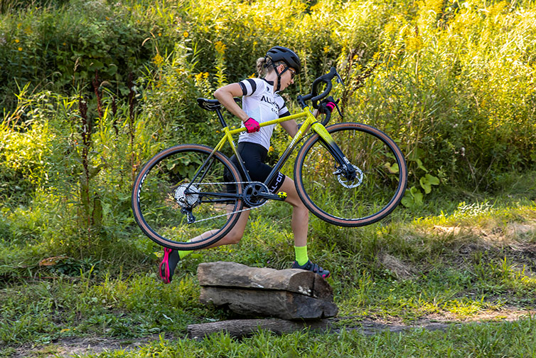 Person carries yellow and black All-City Macho King outdoor trail