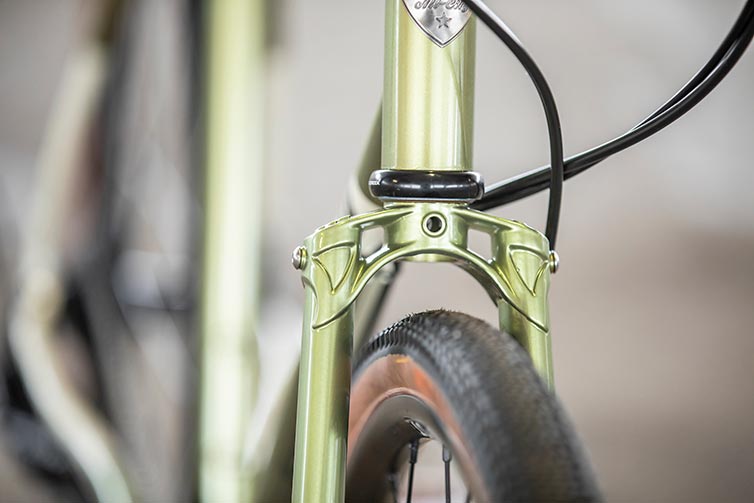 All-City Super Professional fork crown detail showing tire clearance on Apex 1 Flash Basil colorway