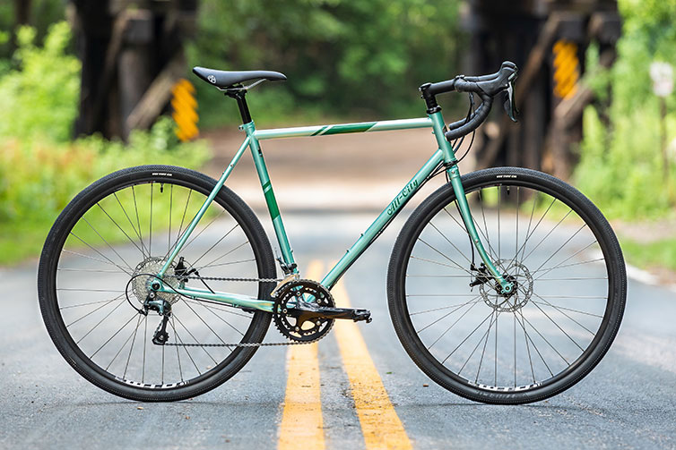 ll-City Spacehorse Tiagra bike, green color, full bike view with an outdoor background