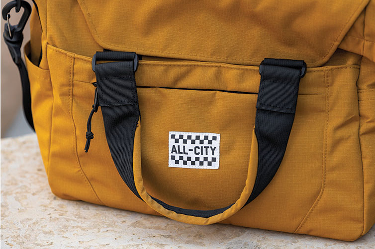 Close-up of All-City Beatbox Front Rack Bag front pannel and carrying handle