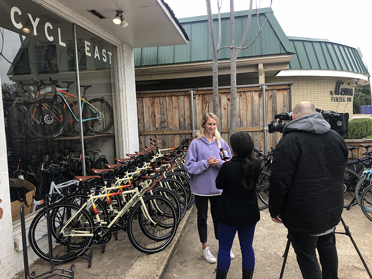 Savannah speaks with news crew outside Cycleast