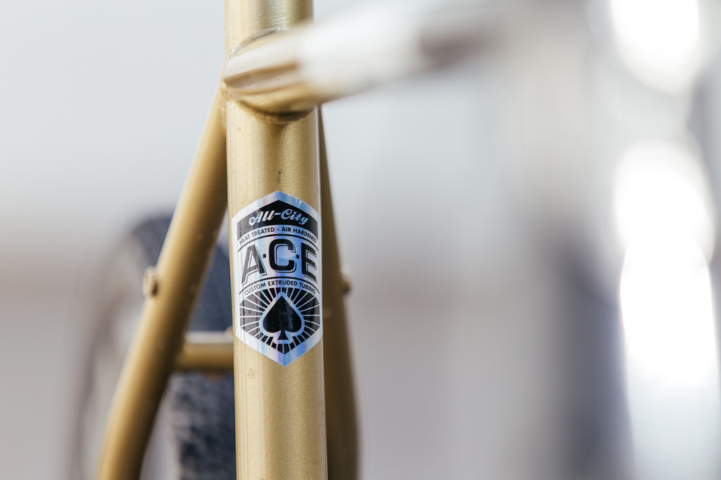 A close up of a gold bike frame