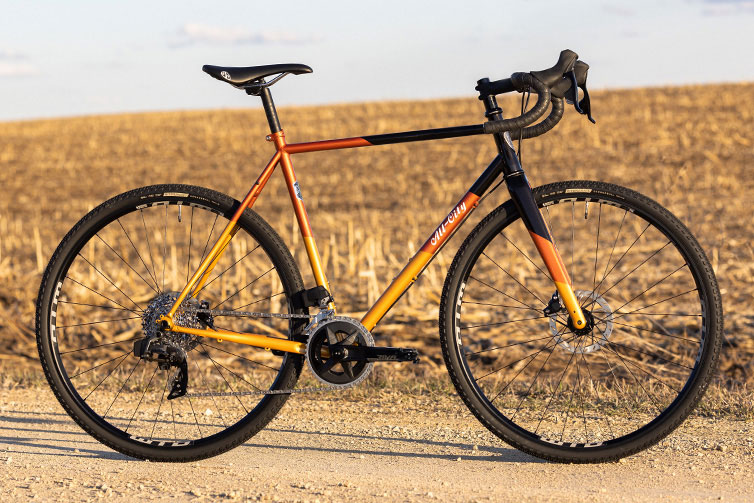 All-City Cosmic Stallion Rival AXS Wide bike side view on gravel road