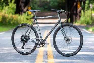 All-City Space Horse microSHIFT flat bar bike side view in middle of road
