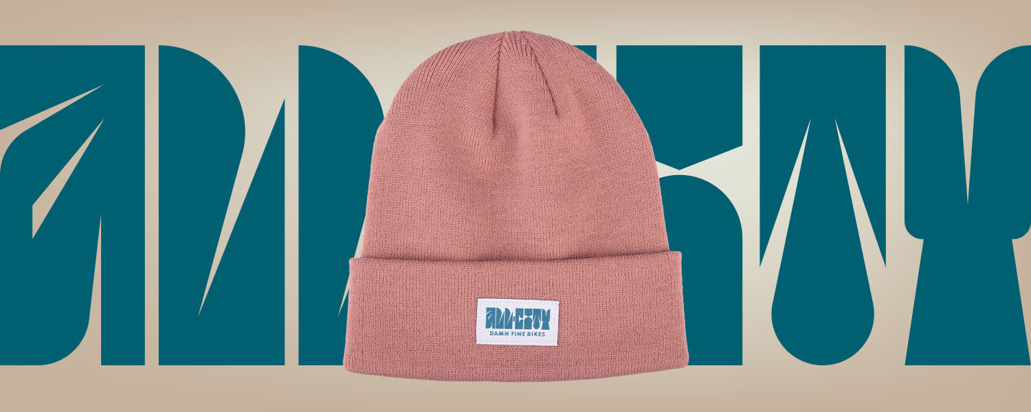 All-City Week-Endo Beanie on designed background using font from hat