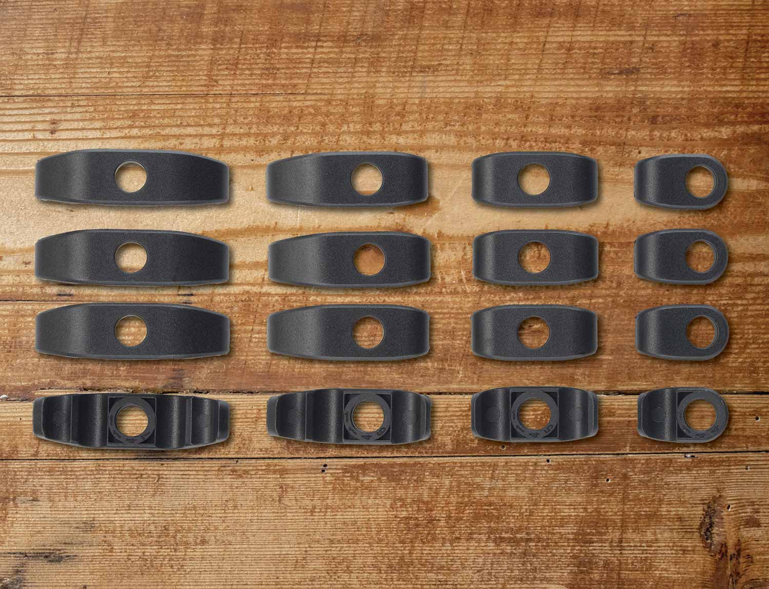 Removable Downtube Cable Guide Sets on wood grain background