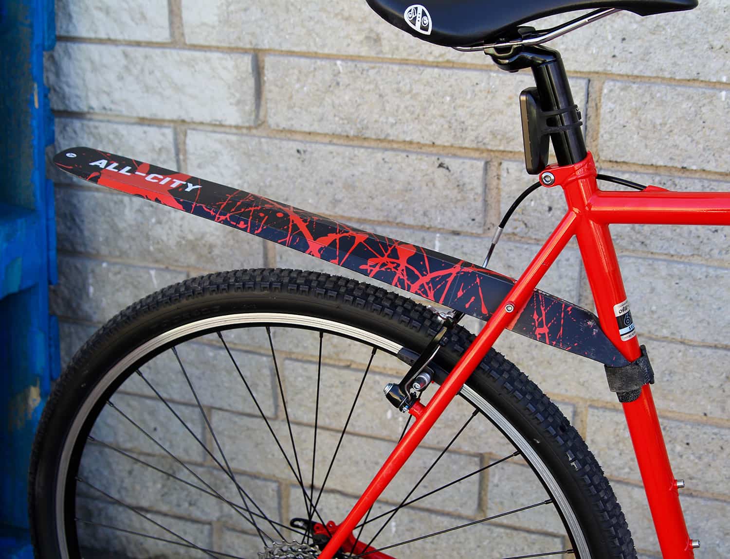 Black and red foldable All-City fender on black and red bike