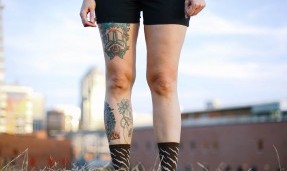 Person from the waste down showcasing Person in shorts wearing Y’All-City brown wool socks outdoor