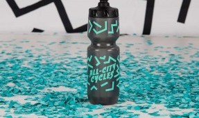 The Max Water Bottle on table with confetti