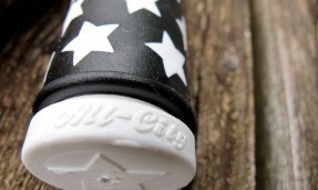 Black and white All-City cycles Star Track grip close up with star detail on wood background