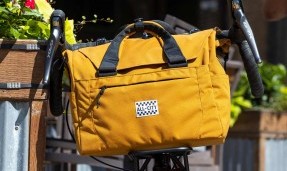 Beat Box Bag on bicycle front rack outside in sun