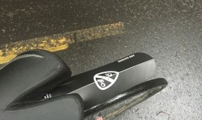 ALL-CITY X ASS SAVERS foldable black fender on black bike seat