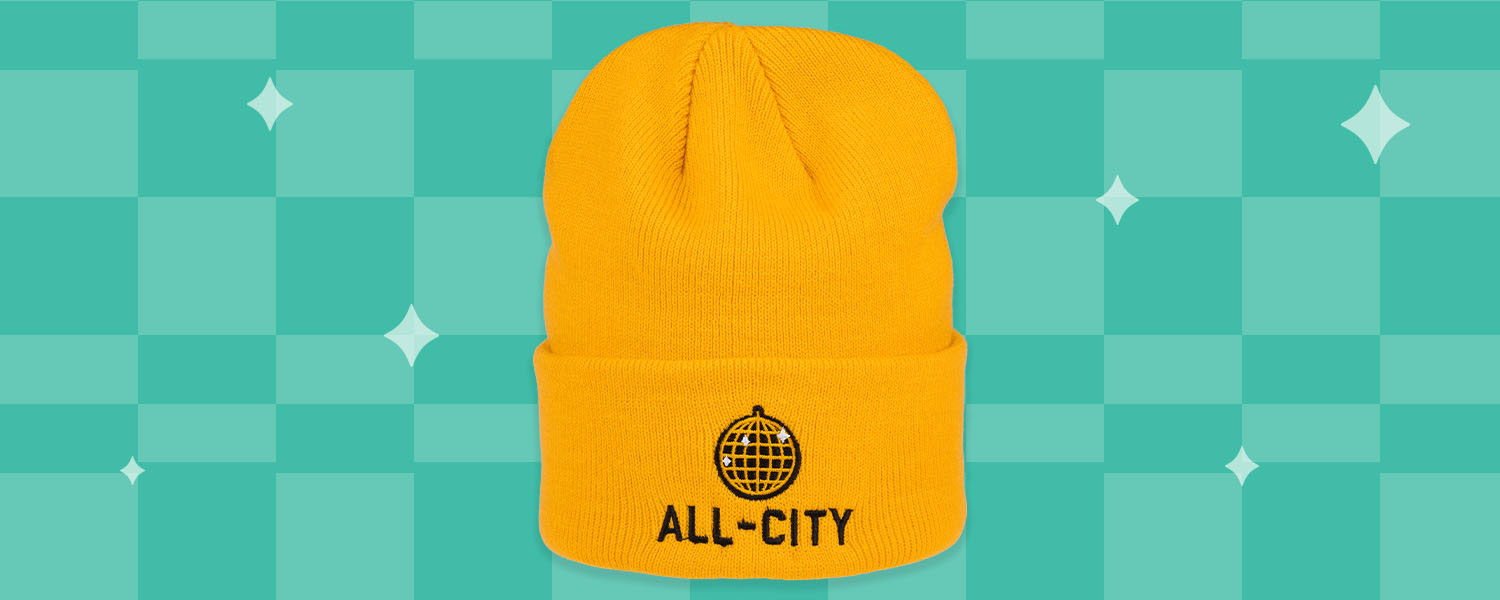 All-City Club Tropic Beanie, yellow color, on illustrated light green checker background