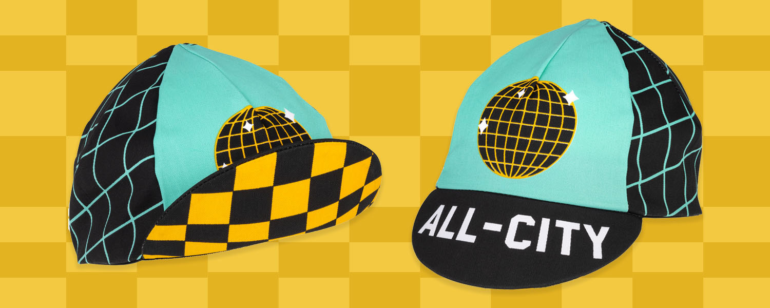 All-City Club Tropic Cycling Cap showing bill down and bill up on illustrated yellow checker background