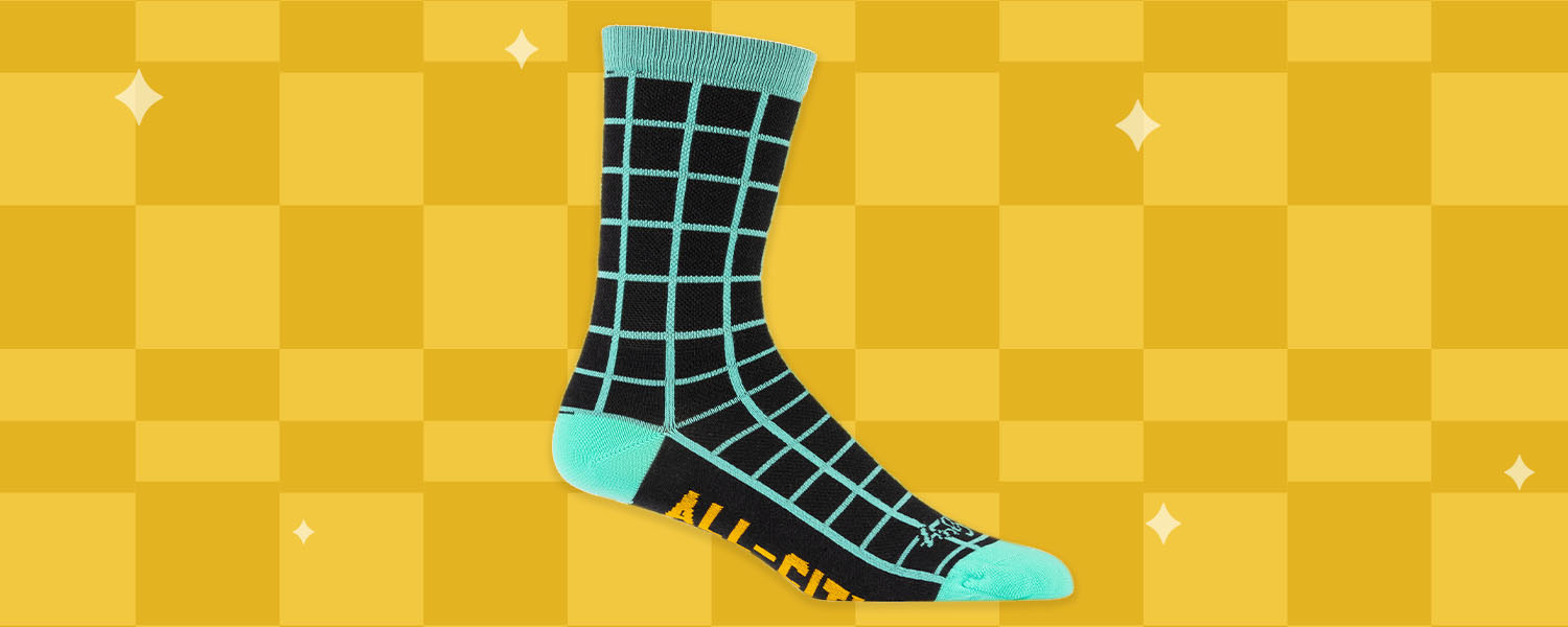 All-City Club Tropic Socks, side view on illustrated yellow checker background