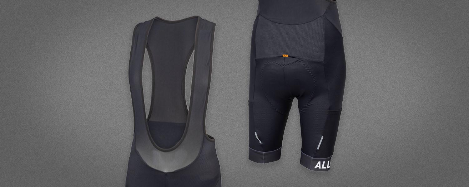Perennial Bib Shorts front and back on gray background