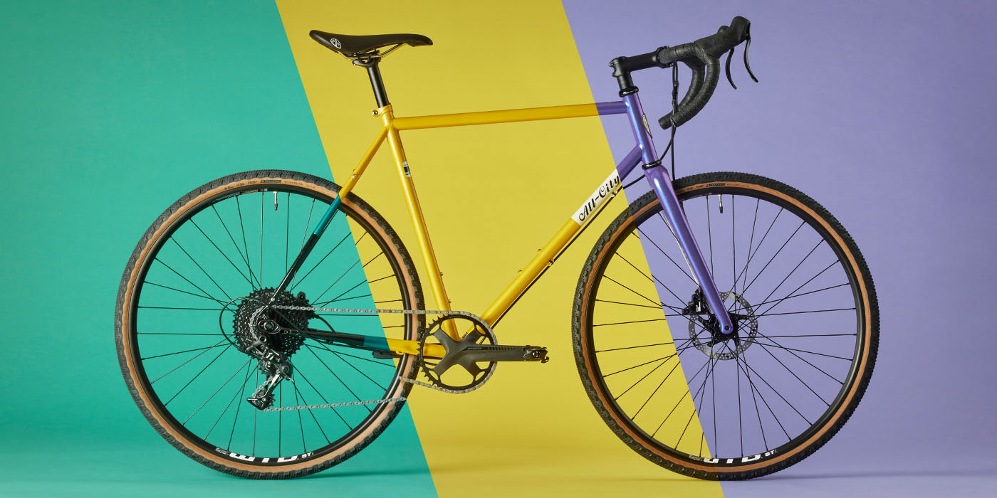 Three specs and colors of All-City Super Professional merged into one bike image with colored background