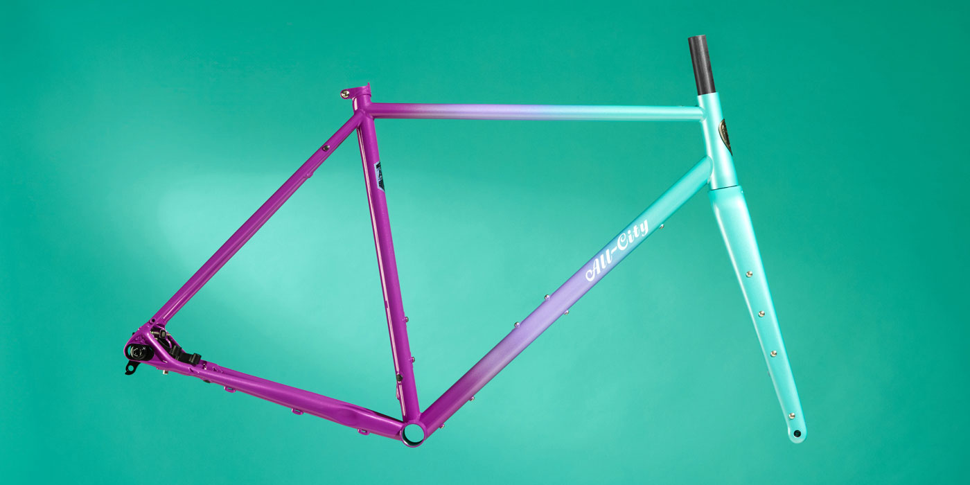 All-City Cosmic Stallion Frameset in Mermaid Fade paint scheme on teal background